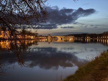 Scenic view of river against sky during sunset