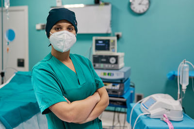 Portrait of surgeon wearing mask in clinic