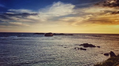 Scenic view of sea at sunset
