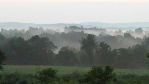 Scenic view of mountains in foggy weather