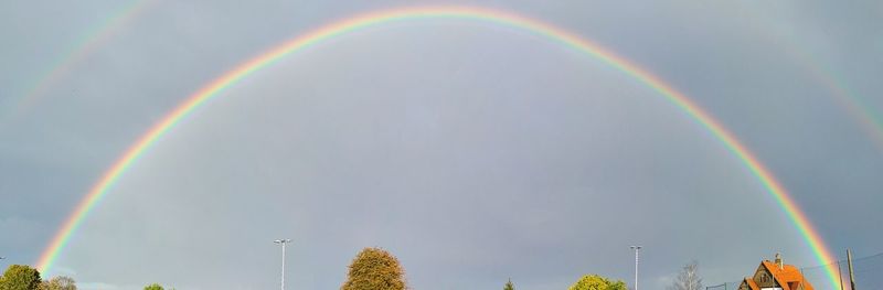 Low angle view of rainbow against sky