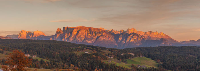 Scenic view of mountains against sky during sunset