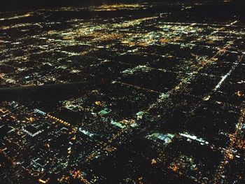 Aerial view of illuminated cityscape at night