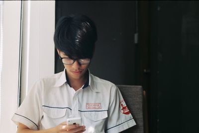 Close-up of young woman in eyeglasses