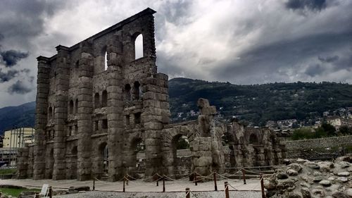 Old ruins of temple against cloudy sky
