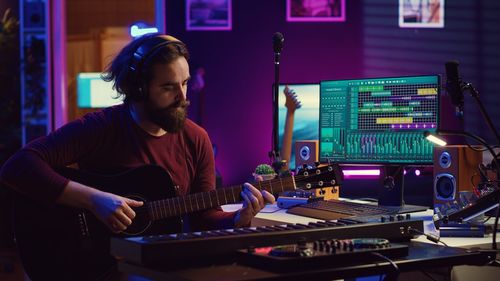 Portrait of man using sound mixer