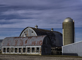 Abandoned factory against sky