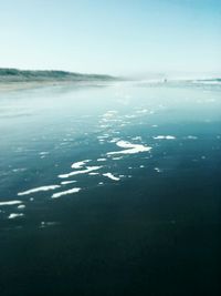 Scenic view of sea against blue sky