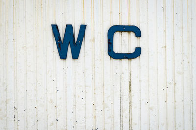 Close-up of alphabets on wall