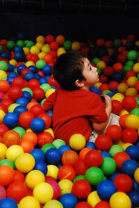 Full length of boy playing with ball