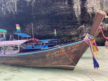 Boats moored on sea shore