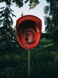 Telephone booth on field