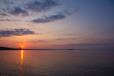 Scenic view of sea against romantic sky at sunset