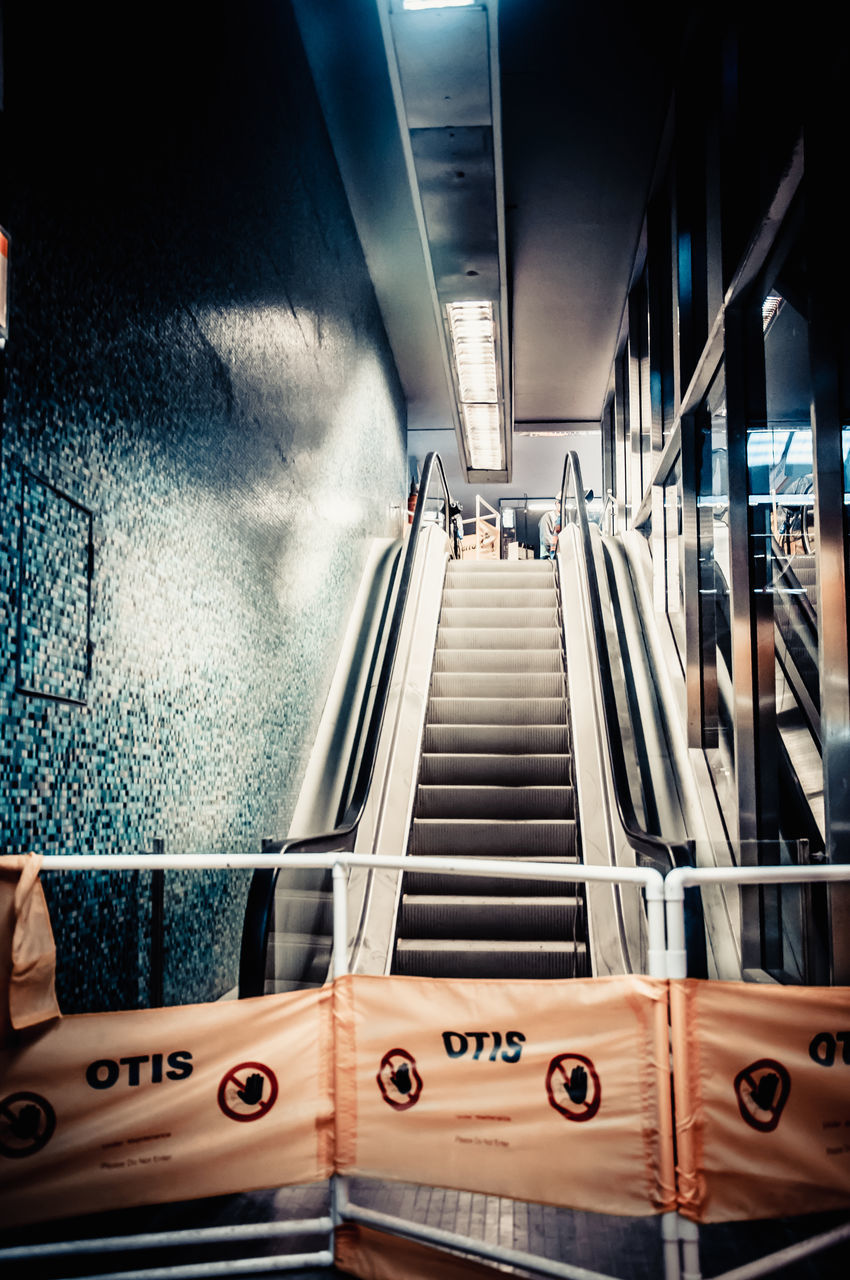 LOW ANGLE VIEW OF ESCALATOR IN UNDERGROUND