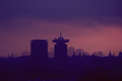 Silhouette of city at sunset