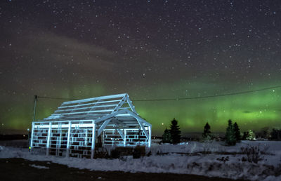 Building against sky at night during winter