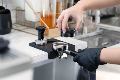 Barista make a coffee with coffee maker at cafe