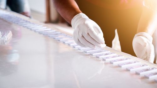 Close-up of man working on table