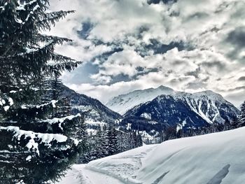 Snow covered mountains against sky
