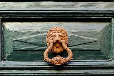 Close-up of sculpture on wooden door