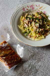 Farfalle with asparagus and bacon, dish of italian cuisine