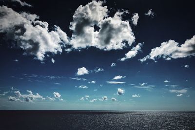 Scenic view of sea against blue sky