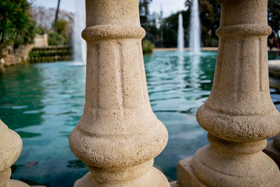 Close-up of railing by river