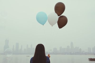 Woman looking at cityscape
