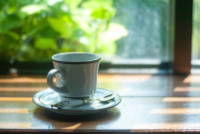 Close-up of coffee cup on table