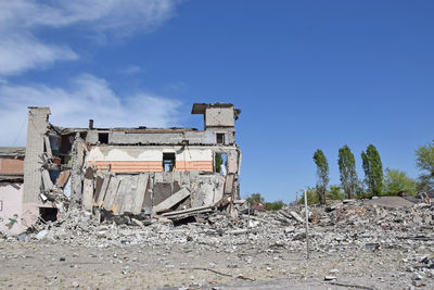 Abandoned building against sky