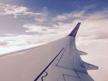 Airplane flying against sky