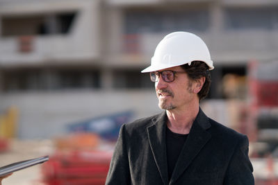 Close-up of man working on construction site