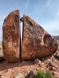 Low angle view of rock formations against sky