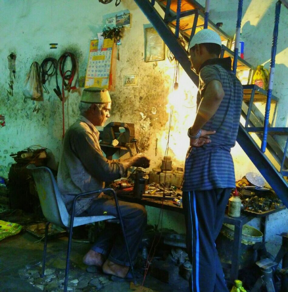 abandoned, obsolete, men, lifestyles, damaged, graffiti, run-down, messy, deterioration, casual clothing, built structure, old, industry, working, wall - building feature, standing, indoors, occupation