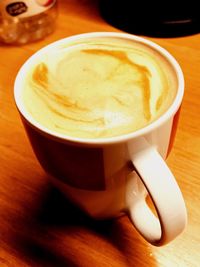 Close-up of cappuccino on table