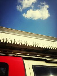 Low angle view of car in city against sky