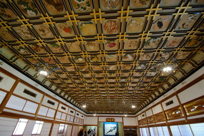 Low angle view of illuminated ceiling of building