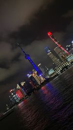 Illuminated modern buildings in city at night