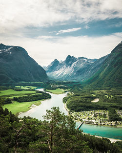 Scenic view of lake and mountains against sky