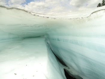 Aerial view of frozen sea against sky