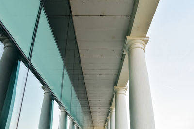 Low angle view of bridge and buildings against sky