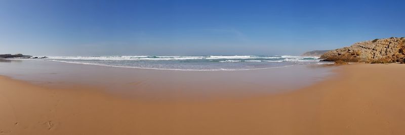 Scenic view of beach against sky