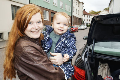 Portrait of mother with baby girl