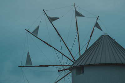 Low angle view of sailboat against blue sky