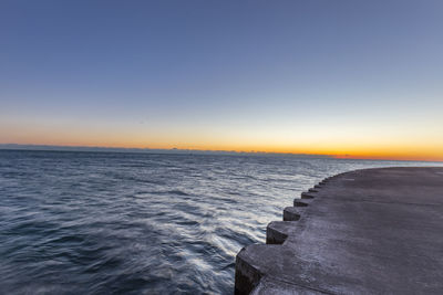 Scenic view of sea at sunset