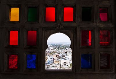 Red building seen through window