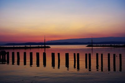 Scenic shot of calm sea against cloudy sky