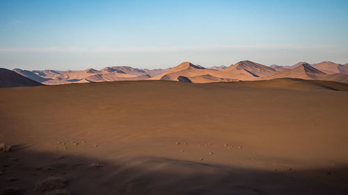 Scenic view of desert against sky