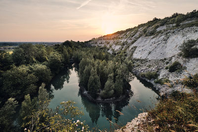 Scenic view of lake against sky during sunset