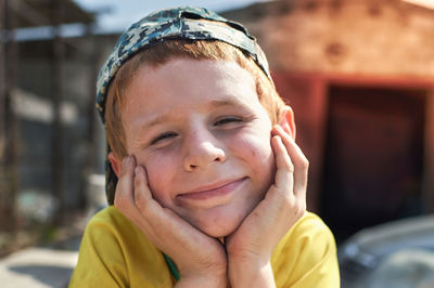 Close-up portrait of smiling boy